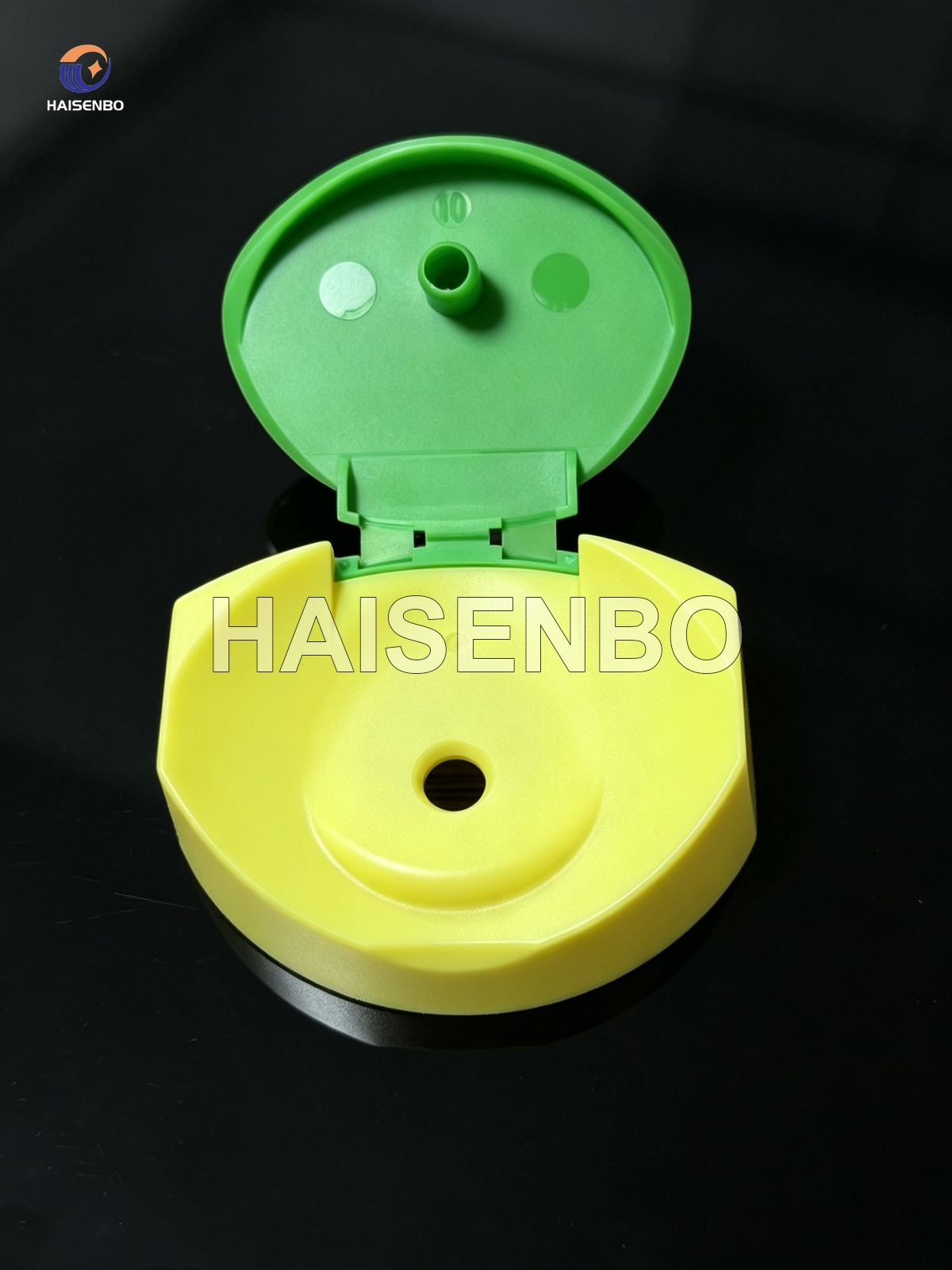 Yellow and green two-color flip top cap, open
